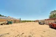 a large bathroom with a sink mirror and toilet