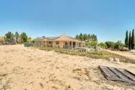 a view of a yard with a house