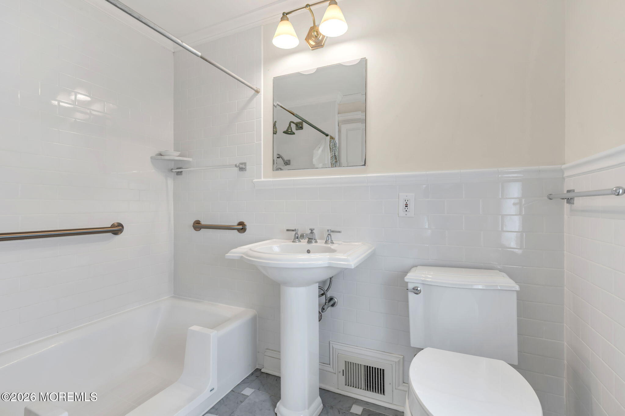 5 Howell Avenue Spring Lake, NJ 07762 - Photo 58 of 92 a bathroom with a sink a toilet and shower