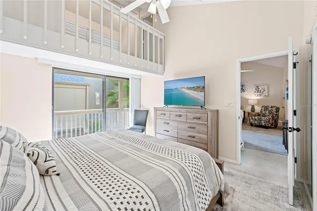 a bedroom with a large bed and a large window