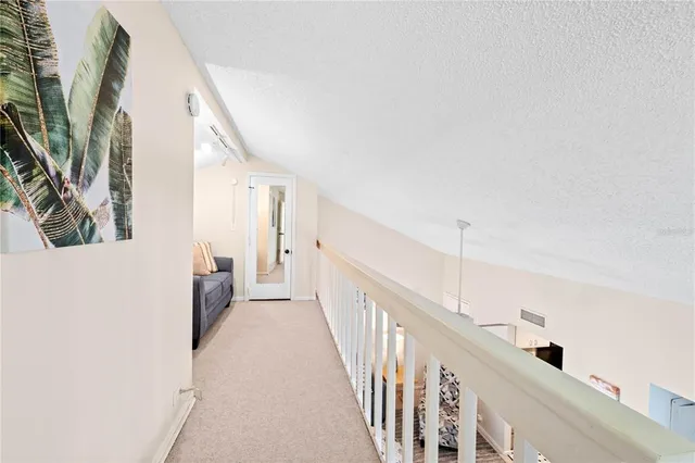 a view of a hallway with staircase