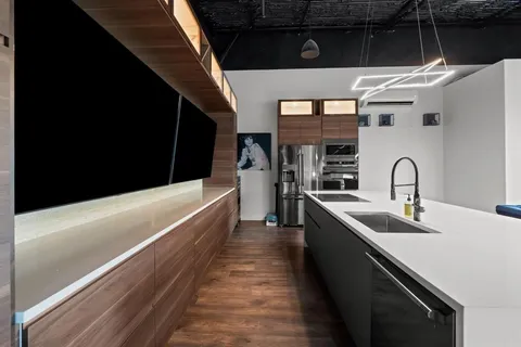 a kitchen with stainless steel appliances a refrigerator and a sink