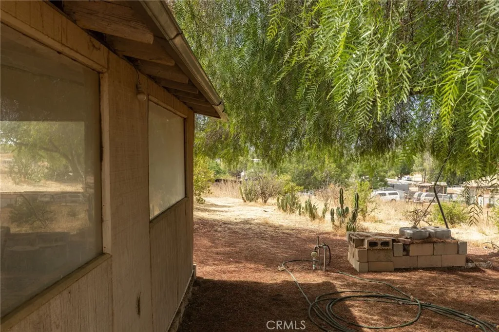21639 Ellis Perris, CA 92570 - Photo 17 of 40 Side of structure with hose bib connection