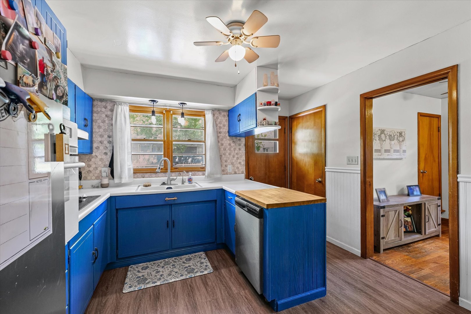 449 South Irving Street Monticello, IL 61856 - Photo 12 of 33 a kitchen with granite countertop stainless steel appliances a sink cabinets and wooden floor