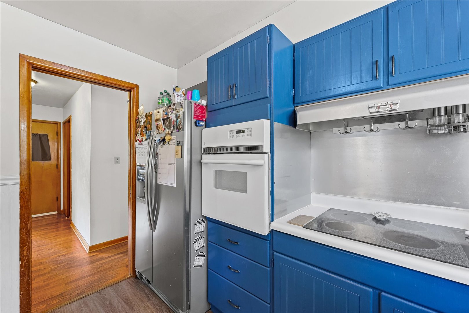 449 South Irving Street Monticello, IL 61856 - Photo 13 of 33 a kitchen with a refrigerator sink and cabinets