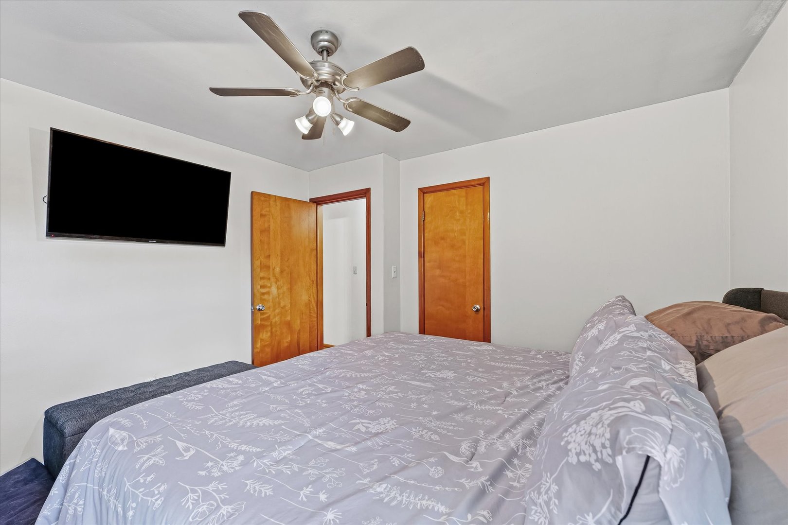 449 South Irving Street Monticello, IL 61856 - Photo 17 of 33 a bedroom with a large bed and a flat screen tv