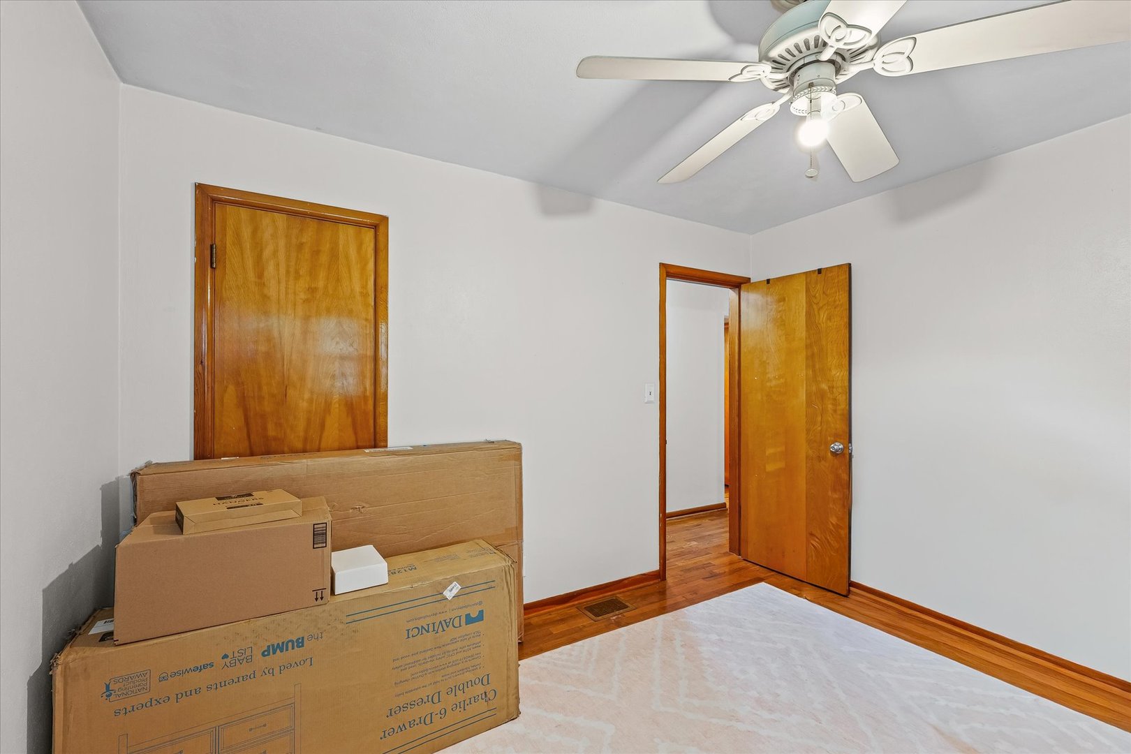 449 South Irving Street Monticello, IL 61856 - Photo 19 of 33 a view of an empty room with window and chandelier fan