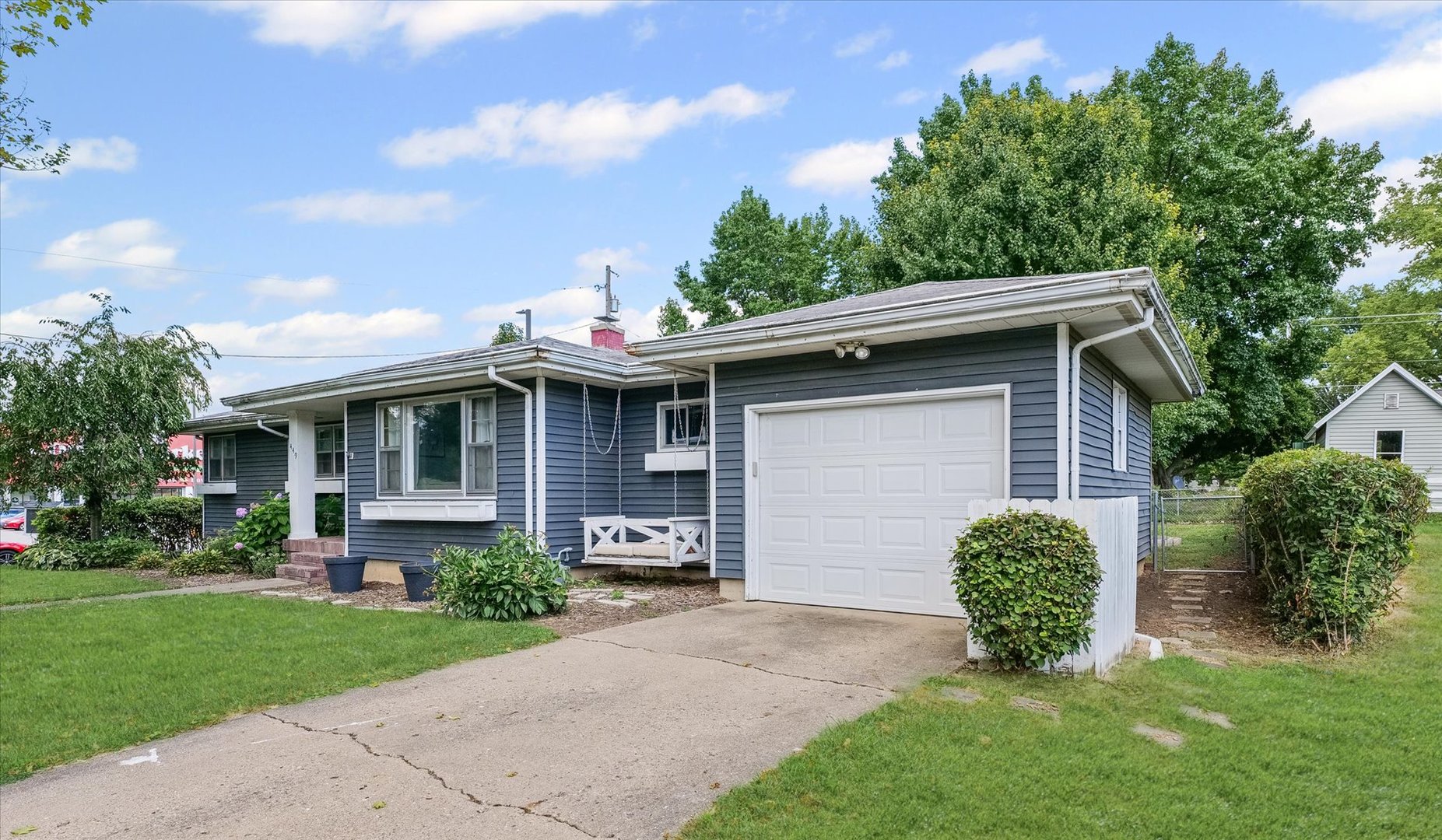 449 South Irving Street Monticello, IL 61856 - Photo 2 of 33 a front view of a house with garden