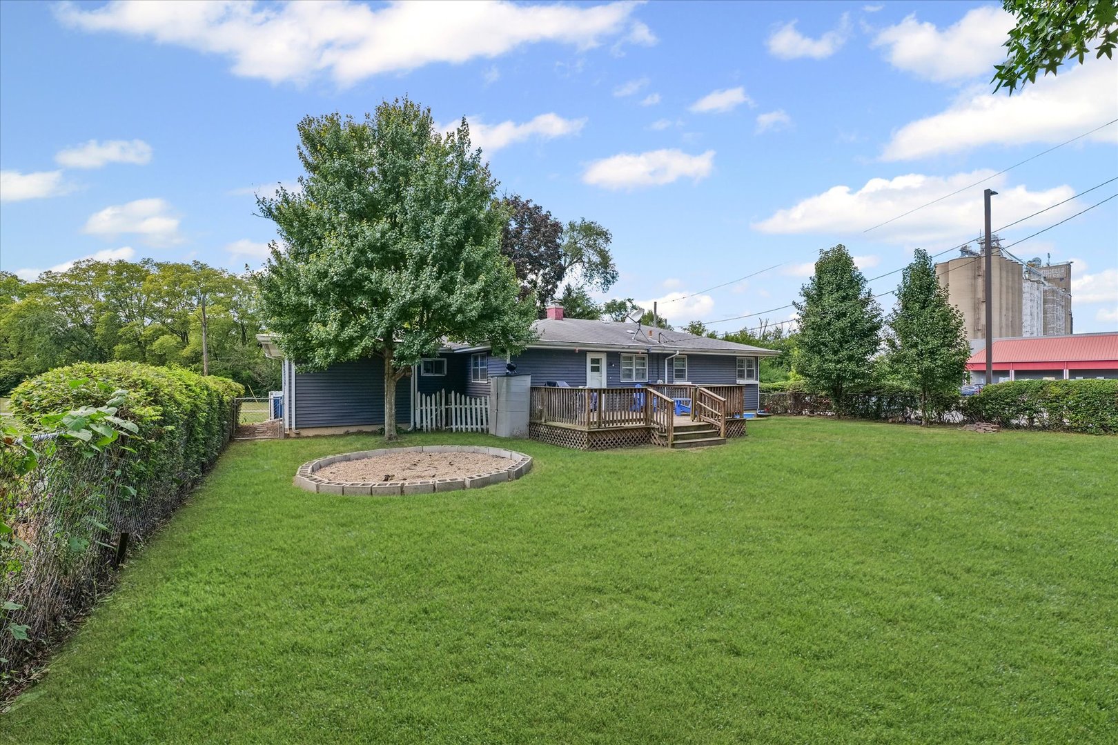 449 South Irving Street Monticello, IL 61856 - Photo 29 of 33 a front view of a house with a garden and plants
