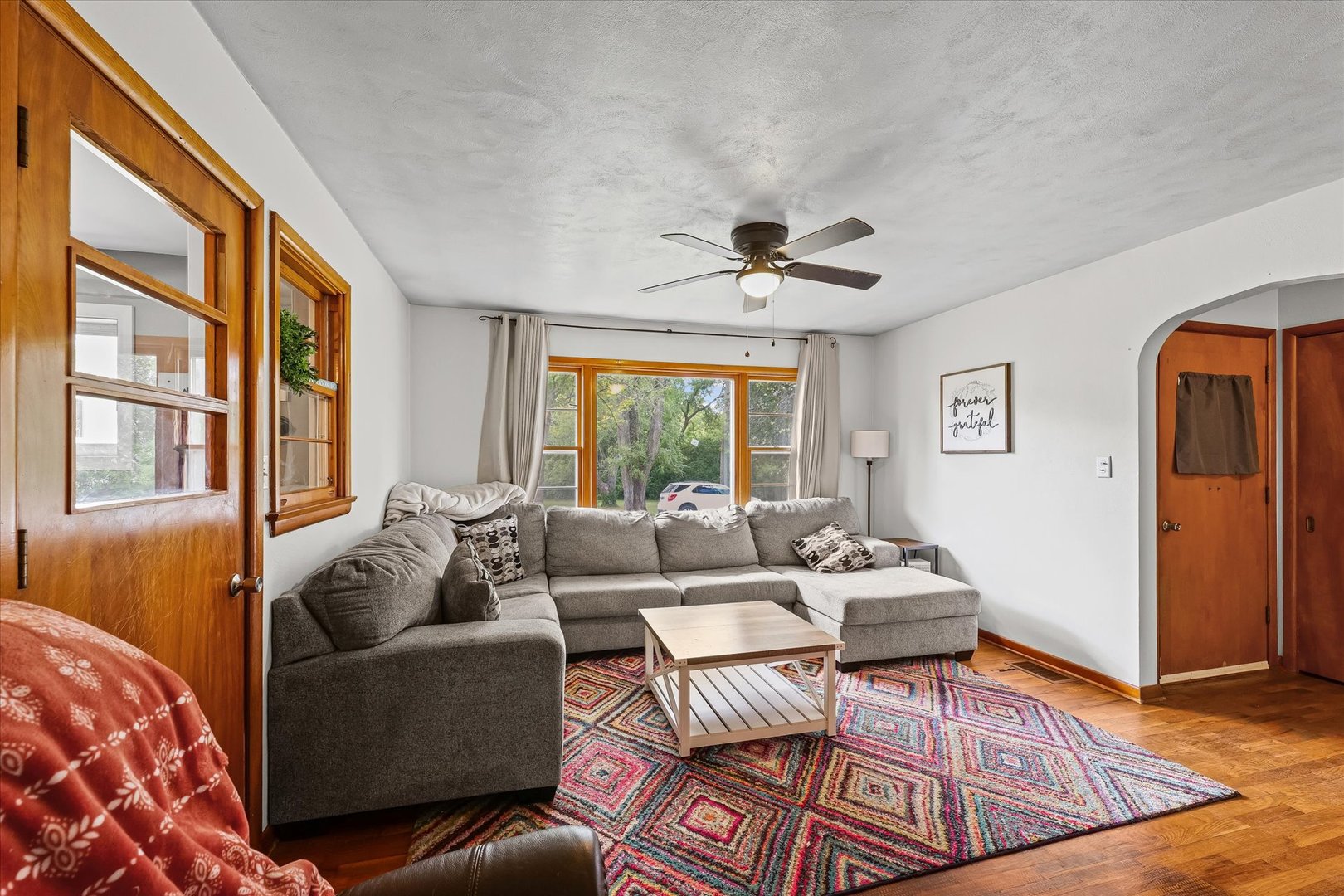 449 South Irving Street Monticello, IL 61856 - Photo 7 of 33 a living room with furniture and a large window
