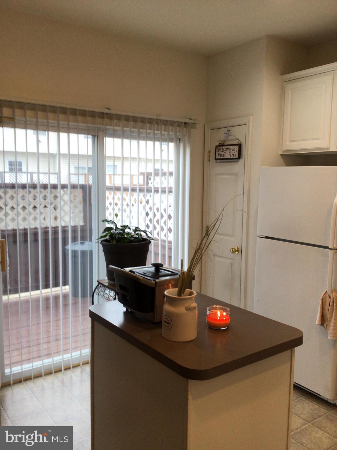 834 Lowe Road Baltimore, MD 21220 - Photo 28 of 39 Kitchen towards back showing sliding patio doors