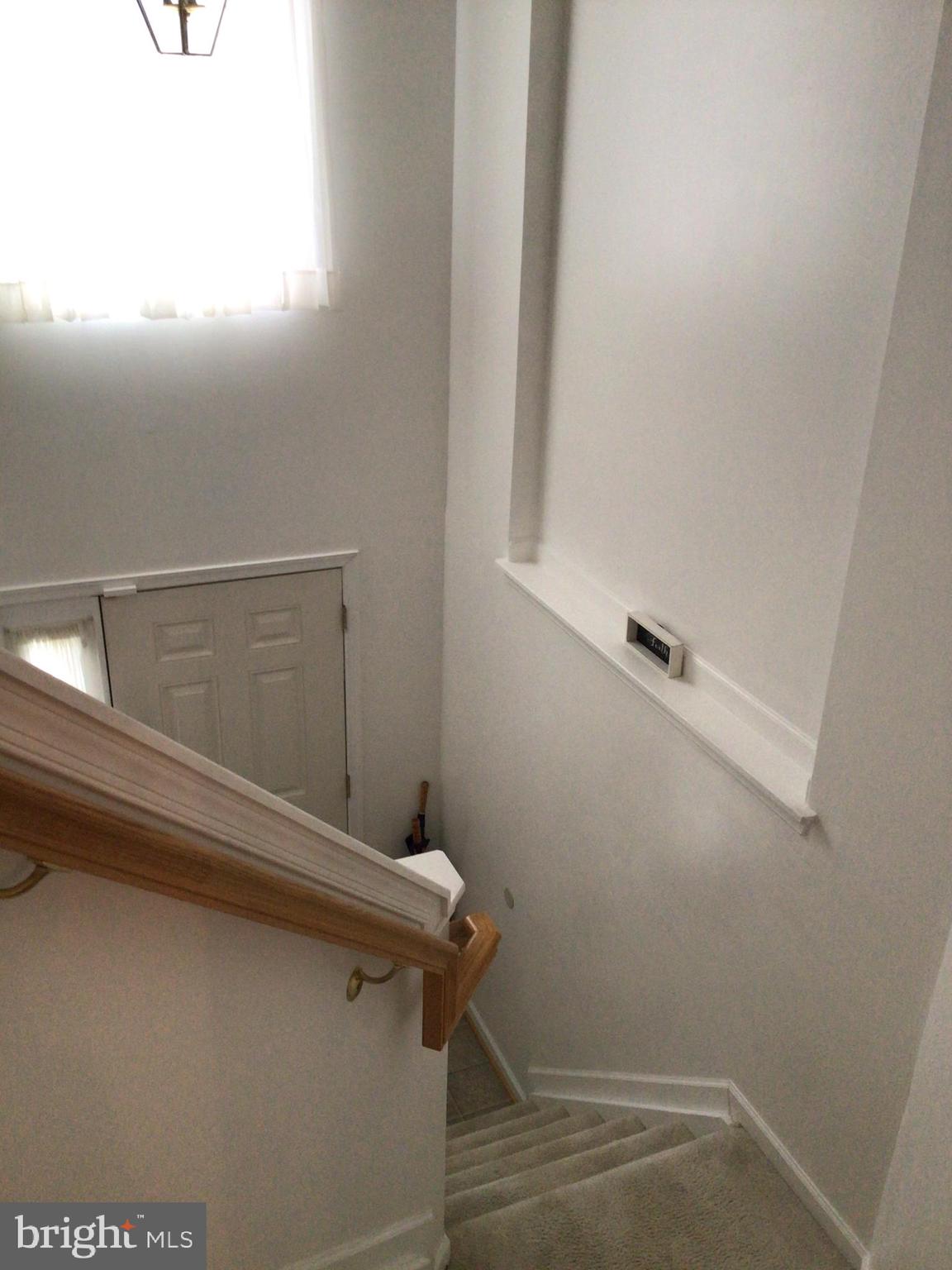 834 Lowe Road Baltimore, MD 21220 - Photo 4 of 39 Stairs from main level down to front entry door