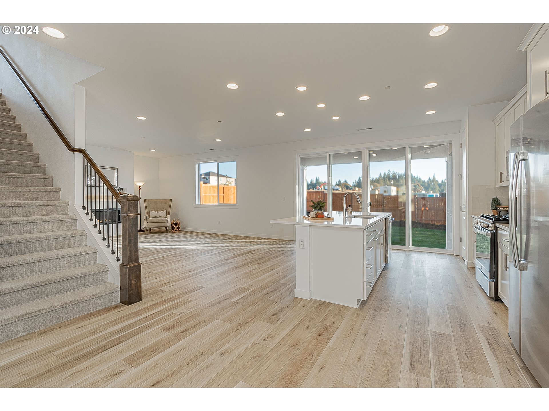 2855 North Mccanta Way Ridgefield, WA 98642 - Photo 8 of 44 a room with wooden floors and stairs