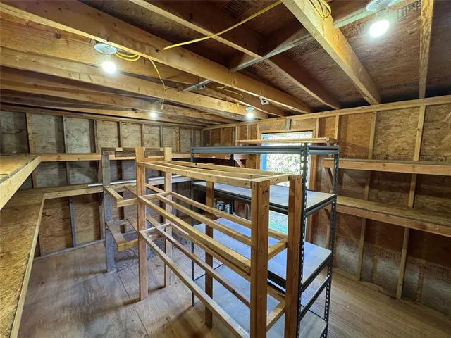 a view of a chairs and table in the balcony