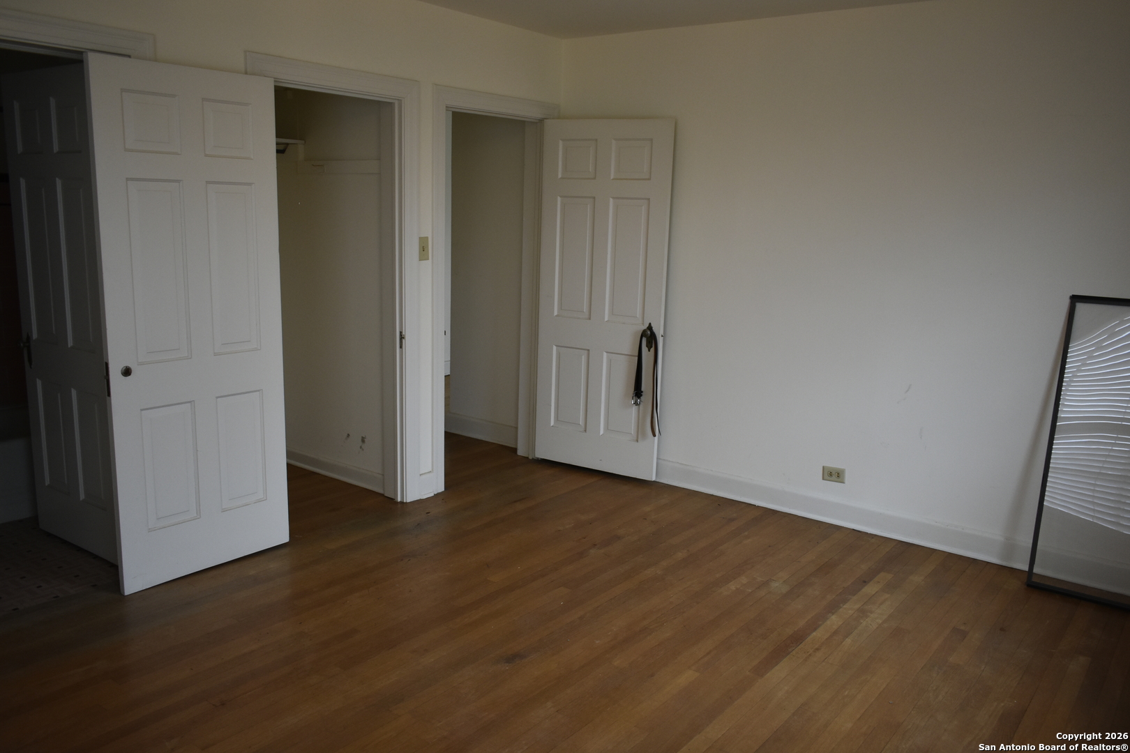 320 Babcock Road San Antonio, TX 78201 - Photo 17 of 27 a view of an empty room with wooden floor