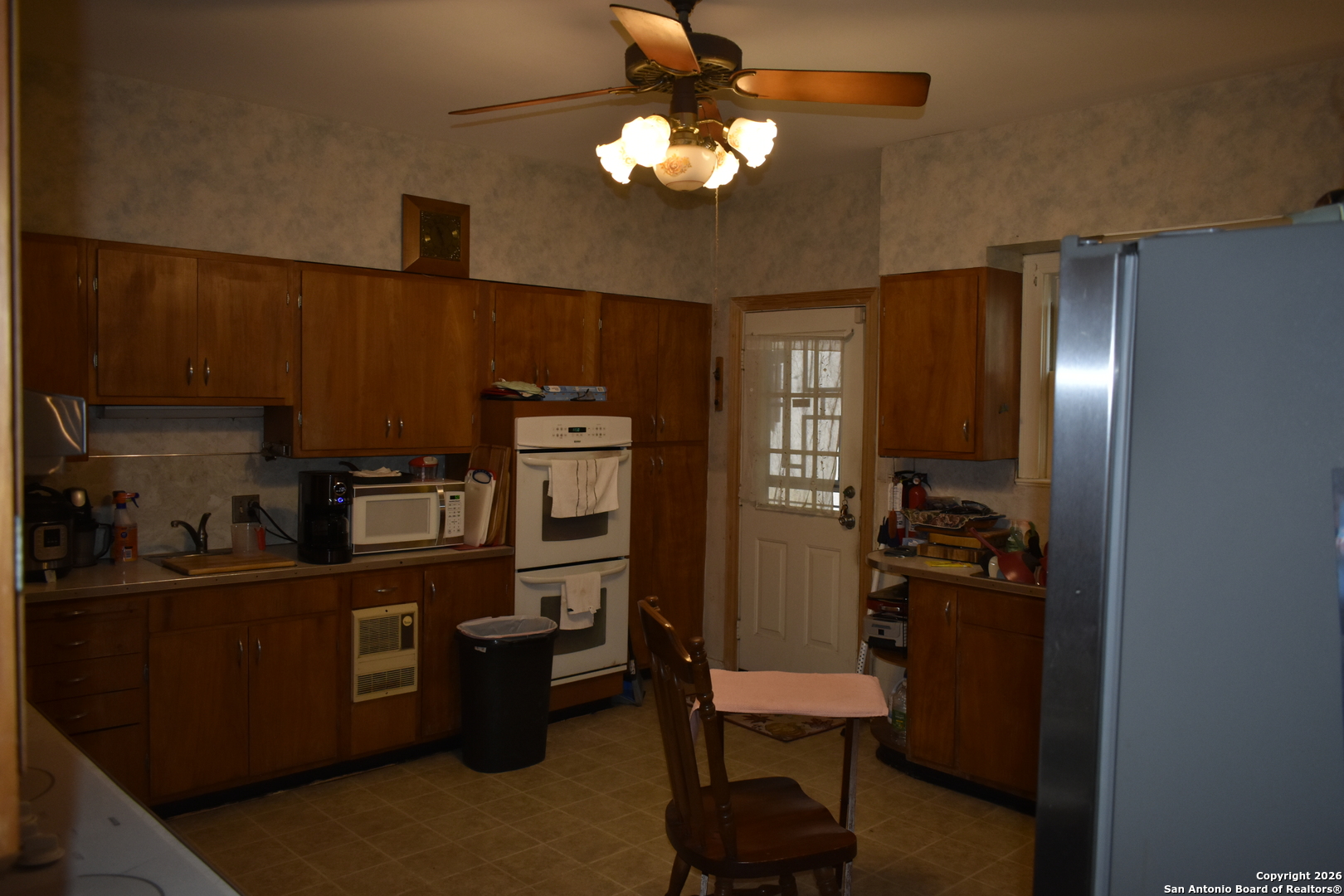 320 Babcock Road San Antonio, TX 78201 - Photo 3 of 27 a kitchen with cabinets a sink and appliances