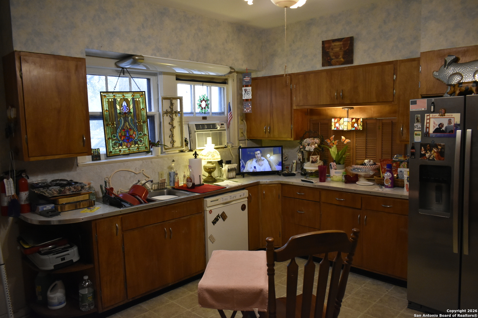 320 Babcock Road San Antonio, TX 78201 - Photo 5 of 27 a kitchen with a sink cabinets and window