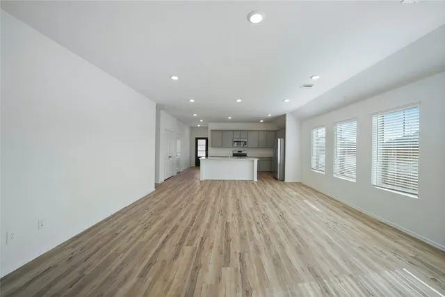 an aerial view of a house with outdoor space