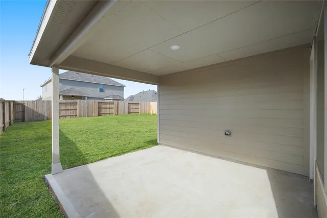 a front view of a house with a garden and yard