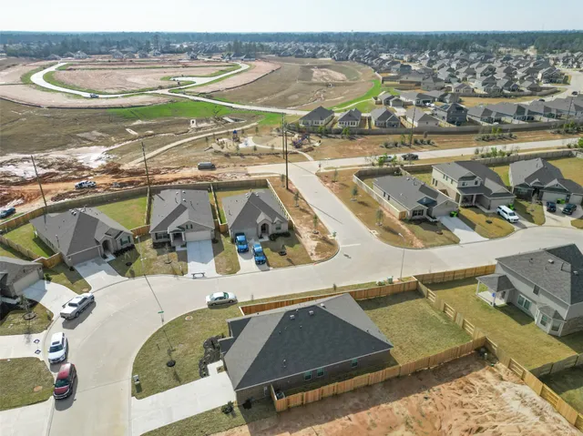 a front view of a house with a yard and porch