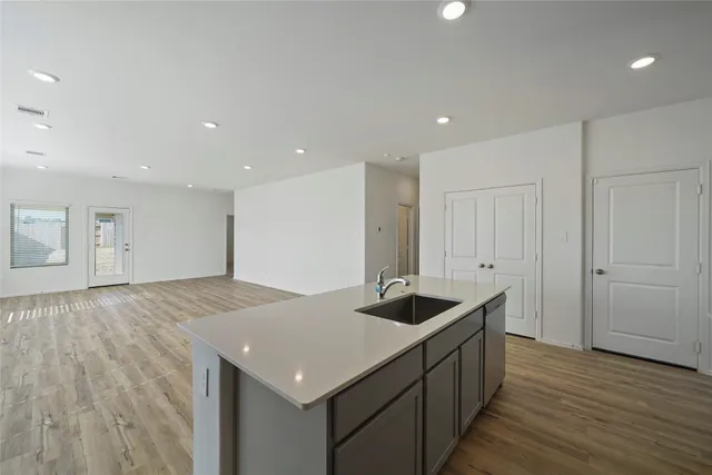 a kitchen with a sink and cabinets
