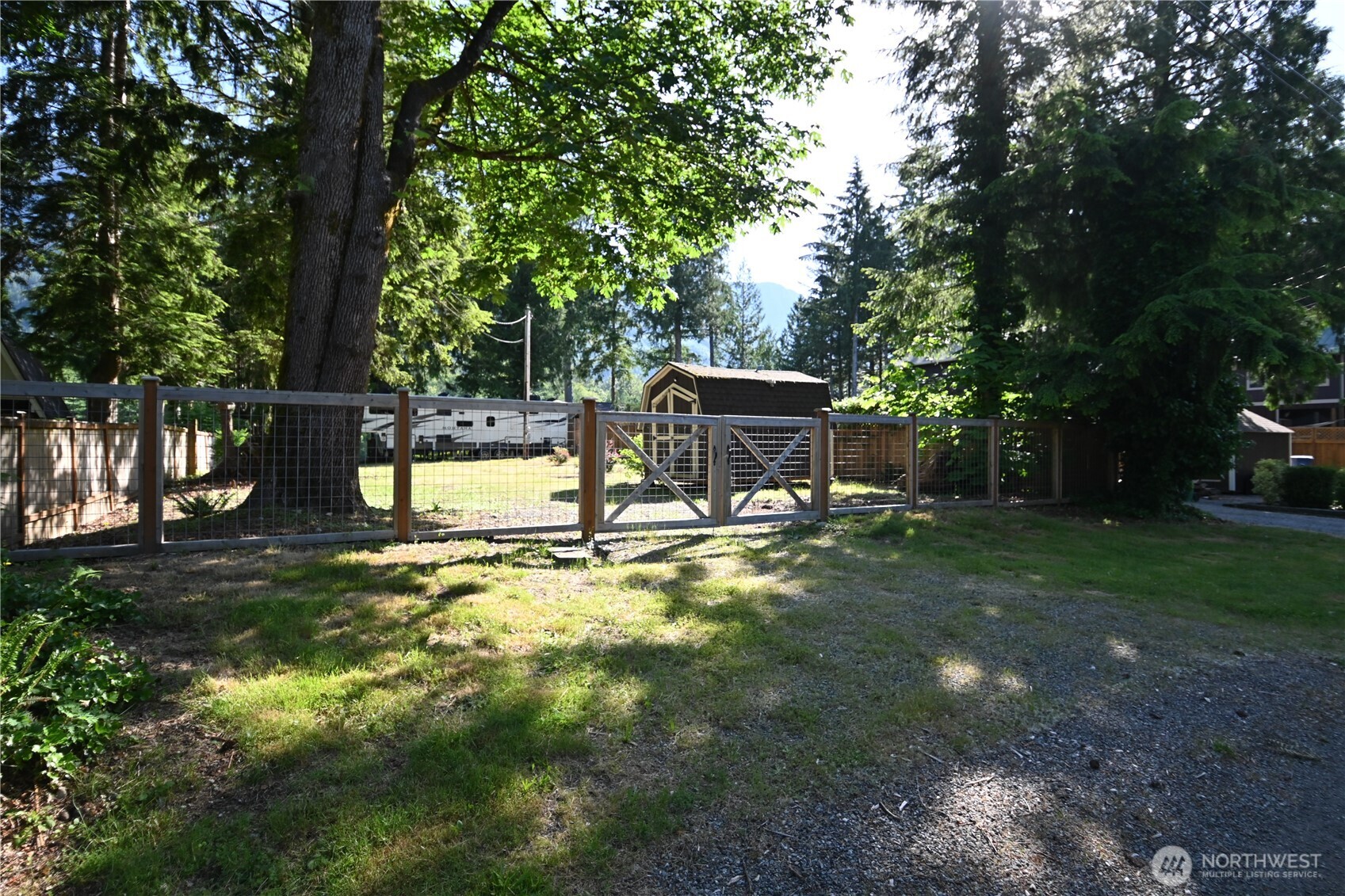 44725 Fir Road Gold Bar, WA 98251 - Photo 7 of 17 a view of a garden with a bench