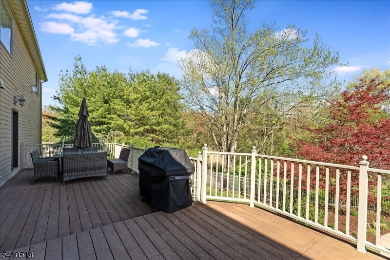 1 Brodziak Road Denville, NJ 07834 - Photo 30 of 42 a view of a roof deck with couches and wooden floor
