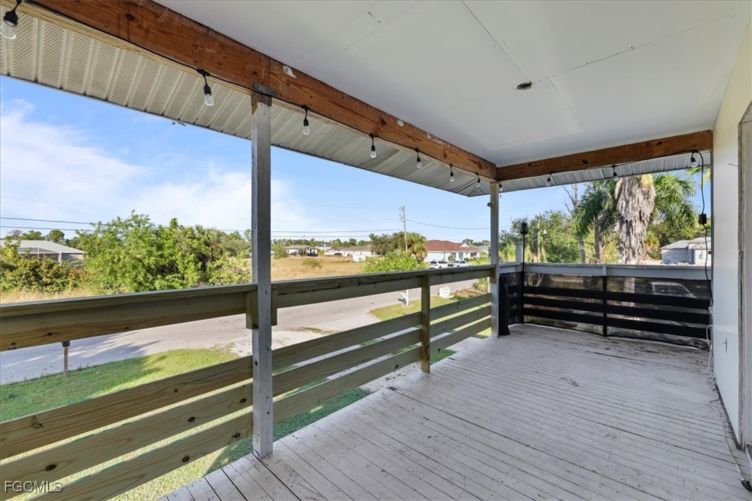 3909 3rd Street Southwest Lehigh Acres, FL 33976 - Photo 13 of 16 a view of a two chairs in the balcony