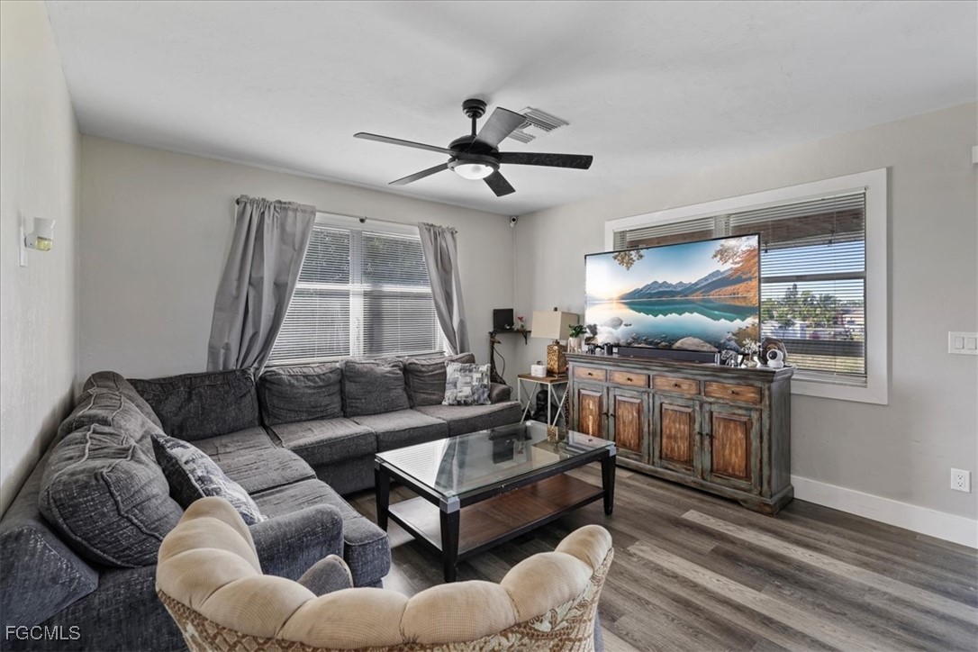 3909 3rd Street Southwest Lehigh Acres, FL 33976 - Photo 6 of 16 a living room with furniture and a window