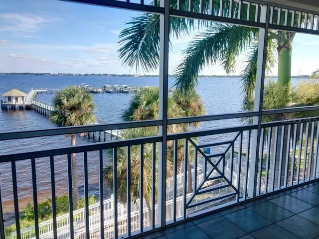 a view of a palm tree from a balcony