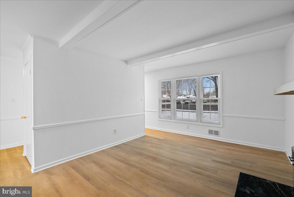 8608 Greeley Boulevard Springfield, VA 22152 - Photo 14 of 34 a view of empty room with wooden floor