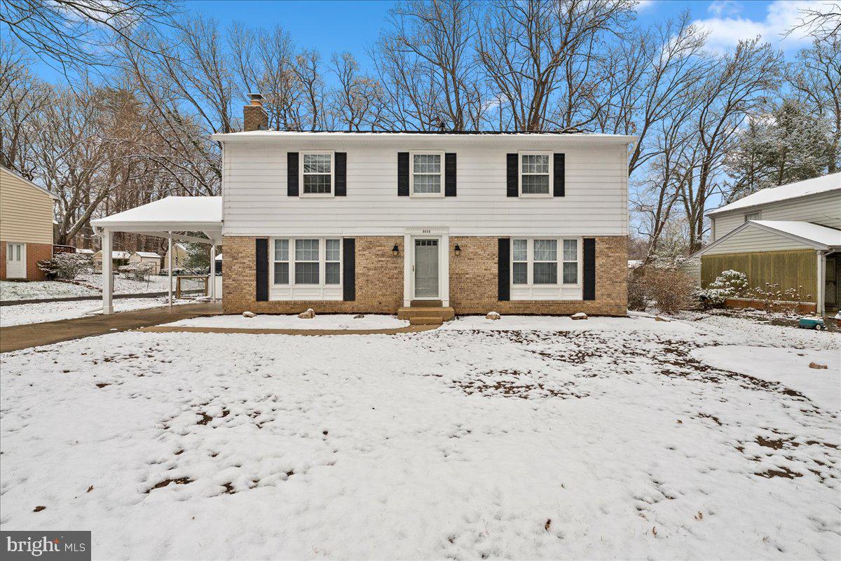 8608 Greeley Boulevard Springfield, VA 22152 - Photo 2 of 34 a front view of a house with a yard