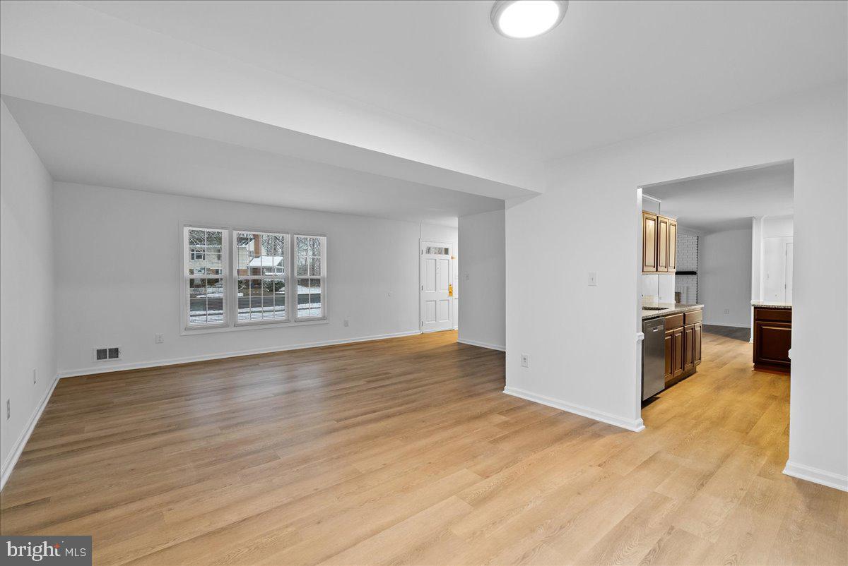 8608 Greeley Boulevard Springfield, VA 22152 - Photo 6 of 34 wooden floor in an empty room