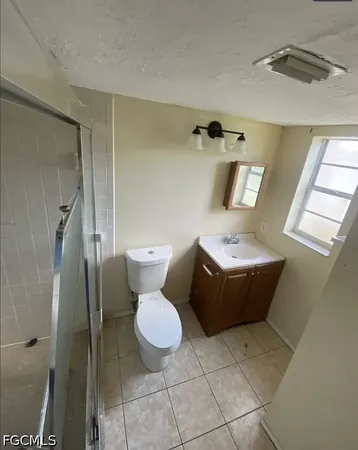 a bathroom with a sink a toilet and bathtub