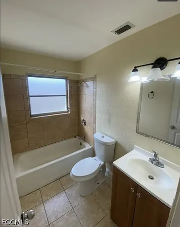 a large kitchen with a stove a refrigerator and a sink
