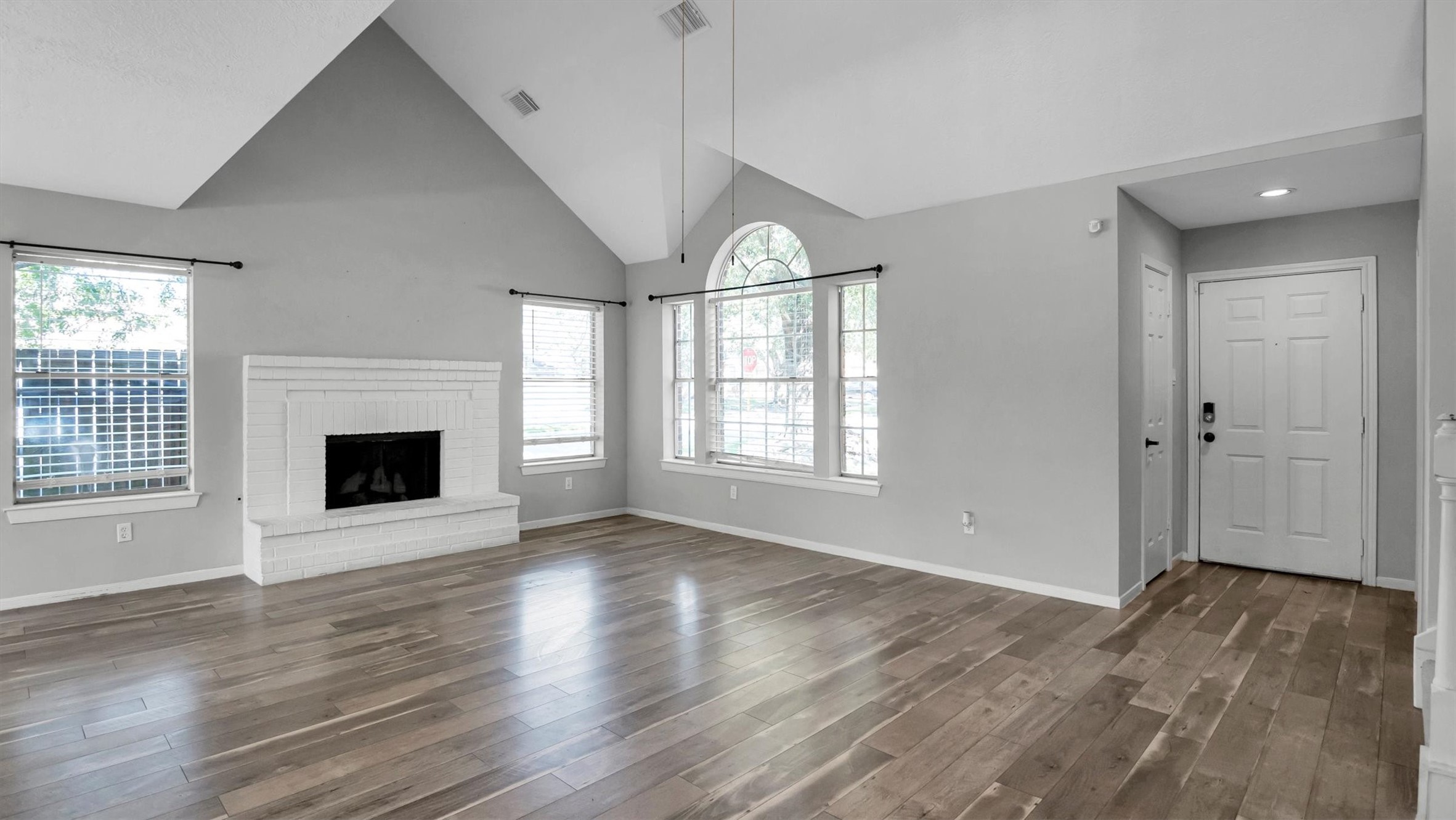22919 Prairie Bird Lane Spring, TX 77373 - Photo 11 of 33 Spacious living area wit cozy wood burning fireplace