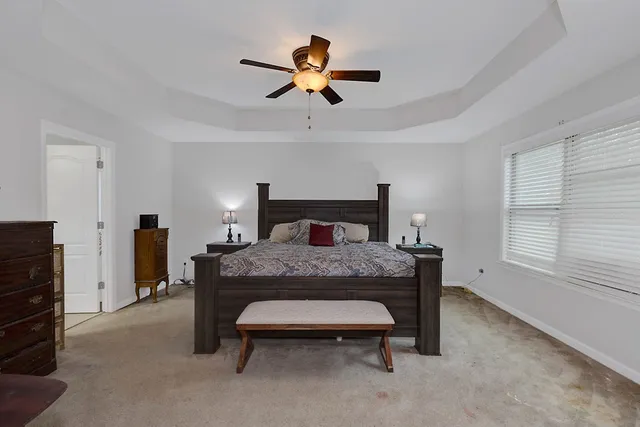 a bedroom with a bed and a dresser