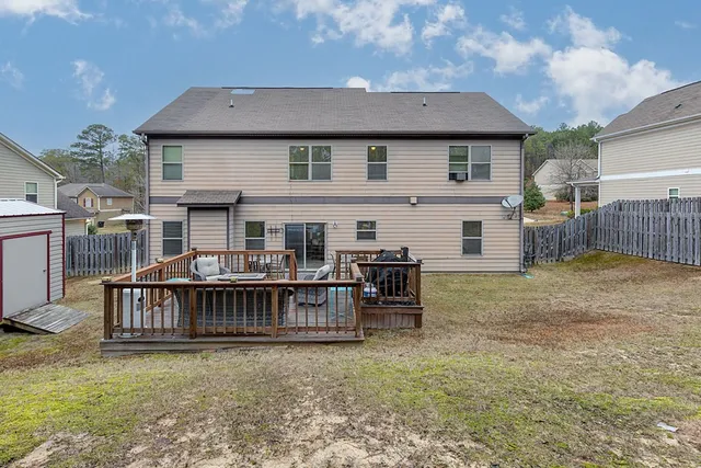 a balcony with table and chairs