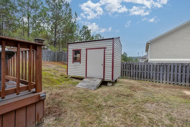an aerial view of a house with swimming pool and mountains