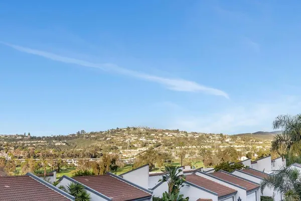 an aerial view of residential building and ocean view