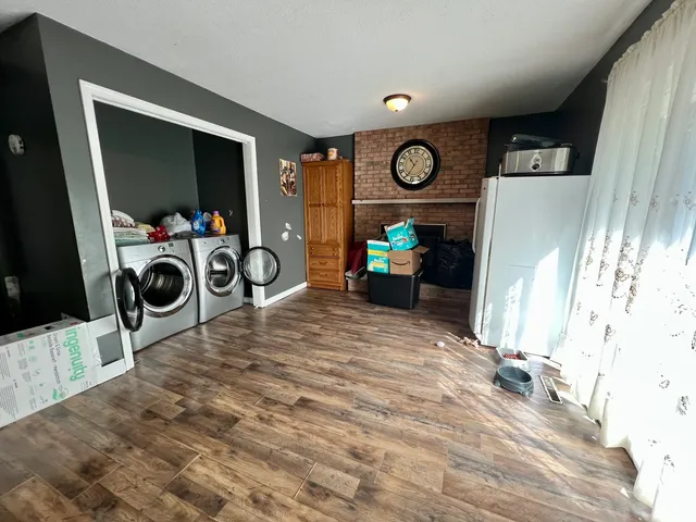 a view of living room with furniture and a flat screen tv
