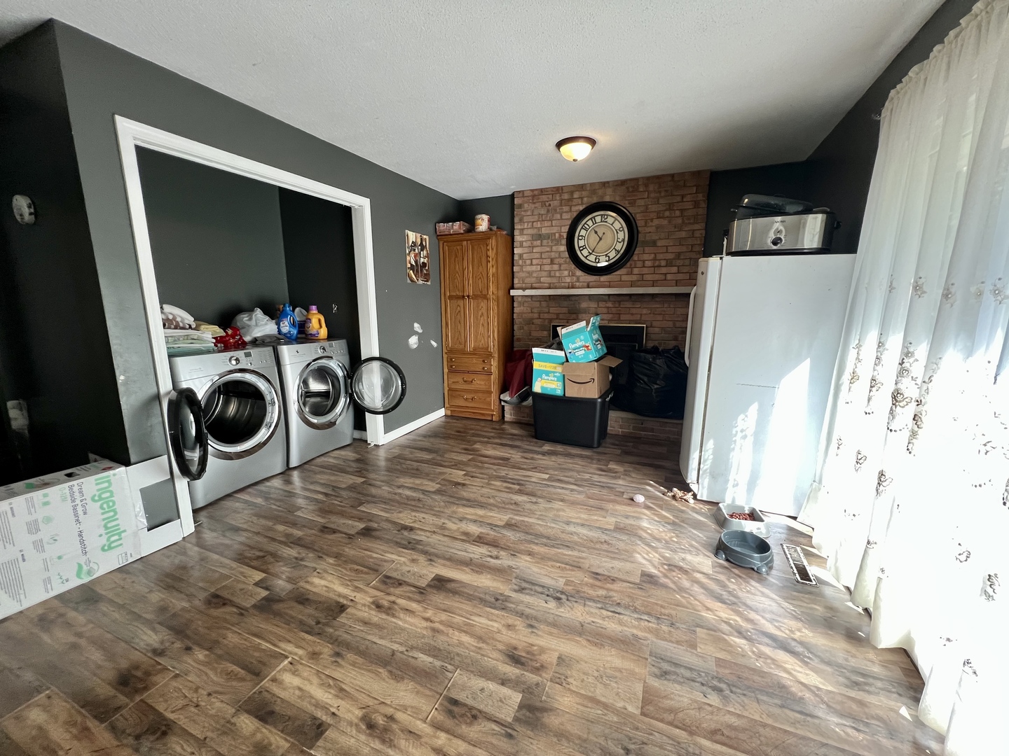 111 Magnolia Drive Villa Grove, IL 61956 - Photo 16 of 37 a view of living room with furniture and a flat screen tv