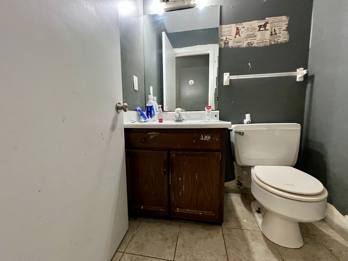 111 Magnolia Drive Villa Grove, IL 61956 - Photo 22 of 37 a bathroom with a toilet and a mirror