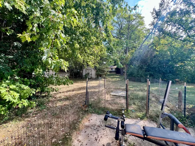 a view of a wooden deck with a backyard