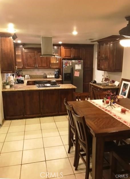 8445 Chaffee Street Rancho Cucamonga, CA 91730 - Photo 3 of 5 a kitchen with a table and chairs