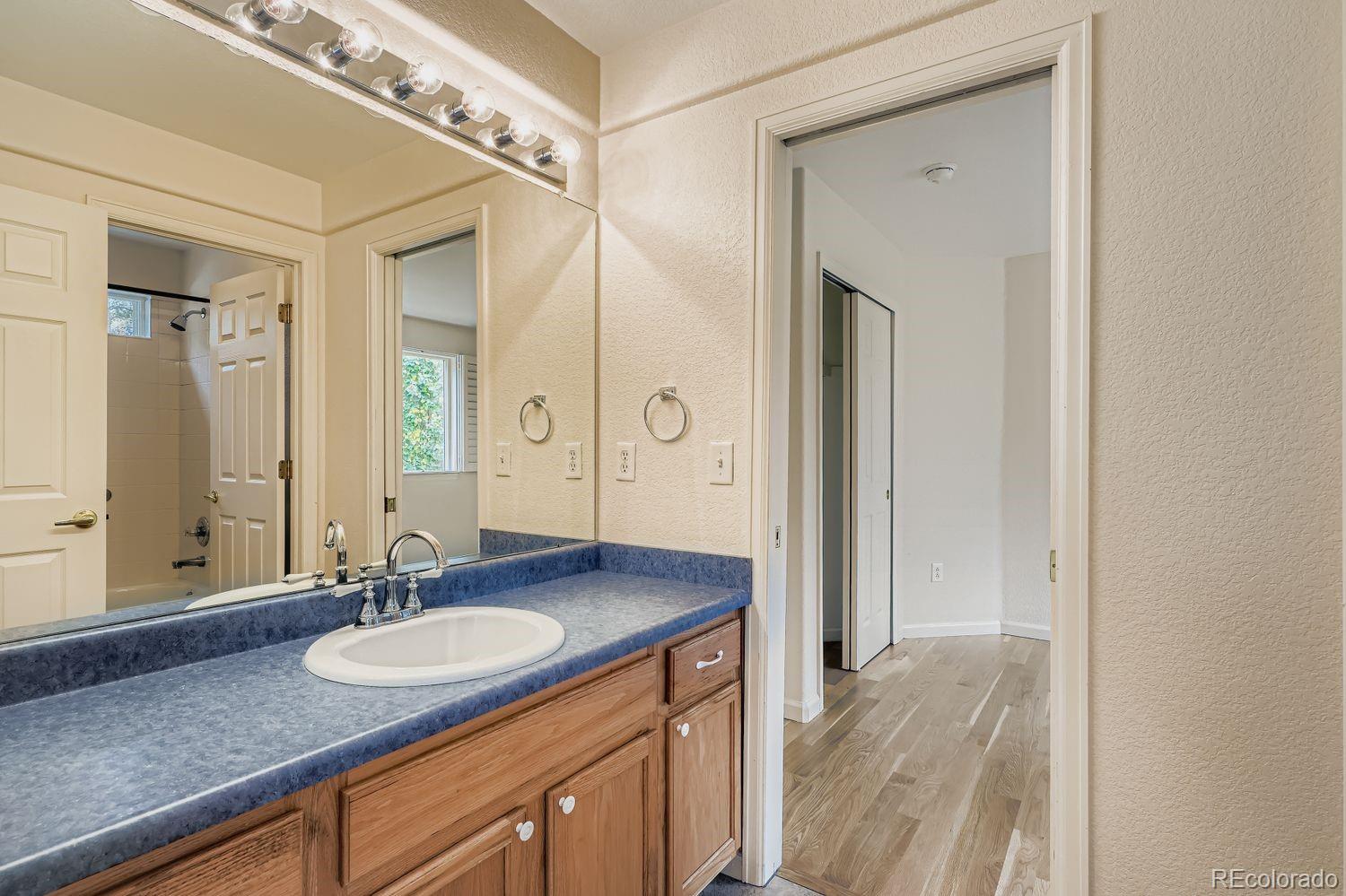 13637 Wamblee Trail Conifer, CO 80433 - Photo 18 of 30 a bathroom with a granite countertop sink and a mirror