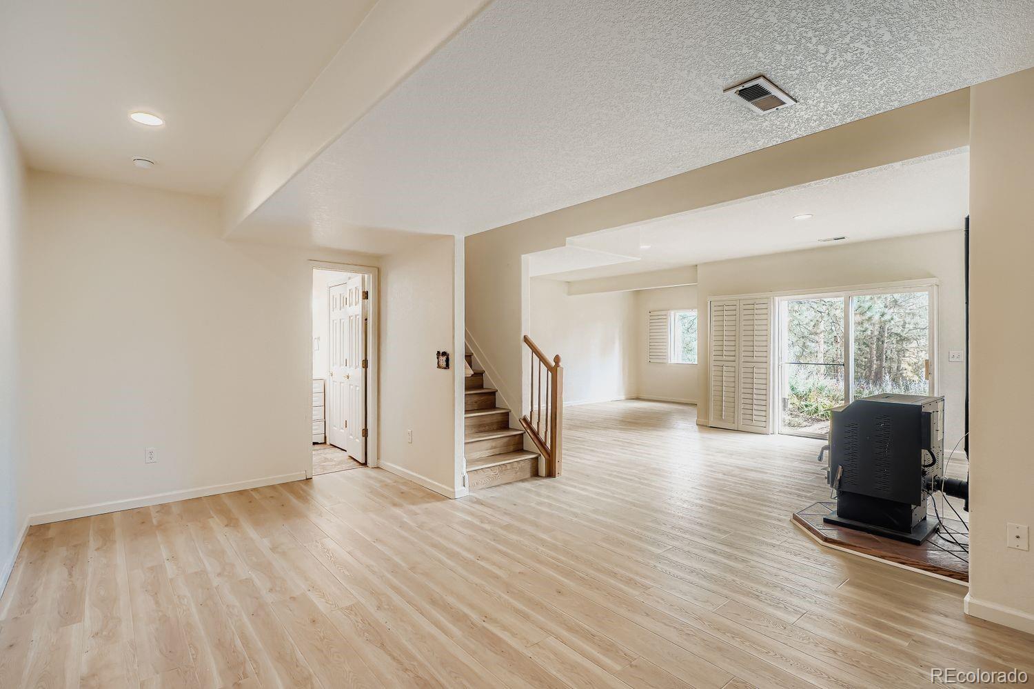 13637 Wamblee Trail Conifer, CO 80433 - Photo 20 of 30 a view of a livingroom with wooden floor and furniture