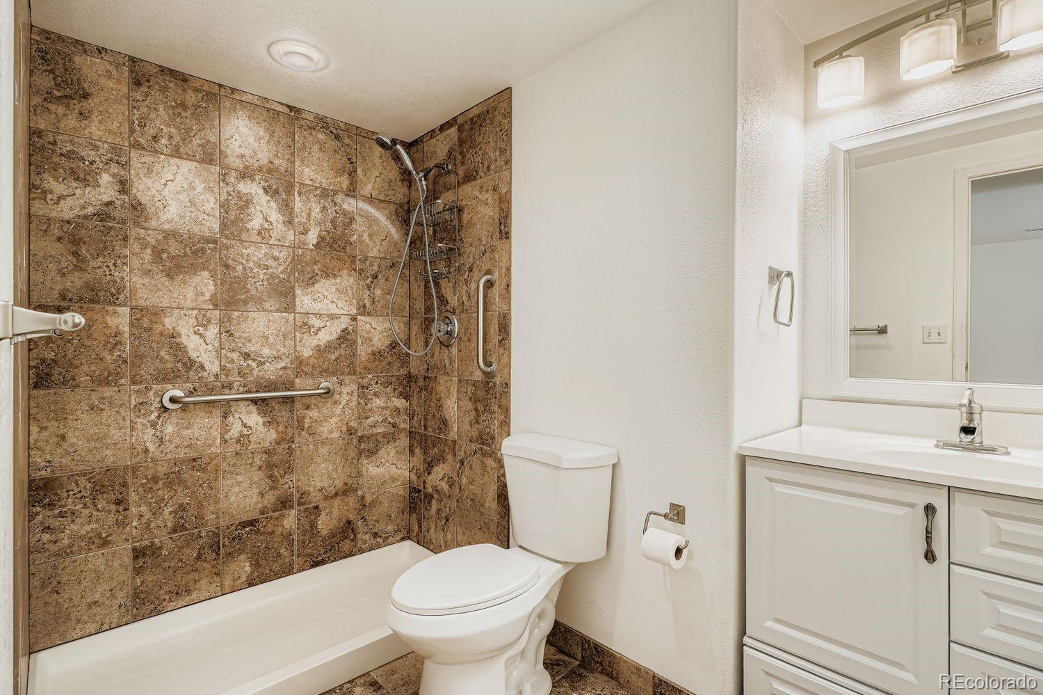13637 Wamblee Trail Conifer, CO 80433 - Photo 22 of 30 a bathroom with a sink toilet and shower