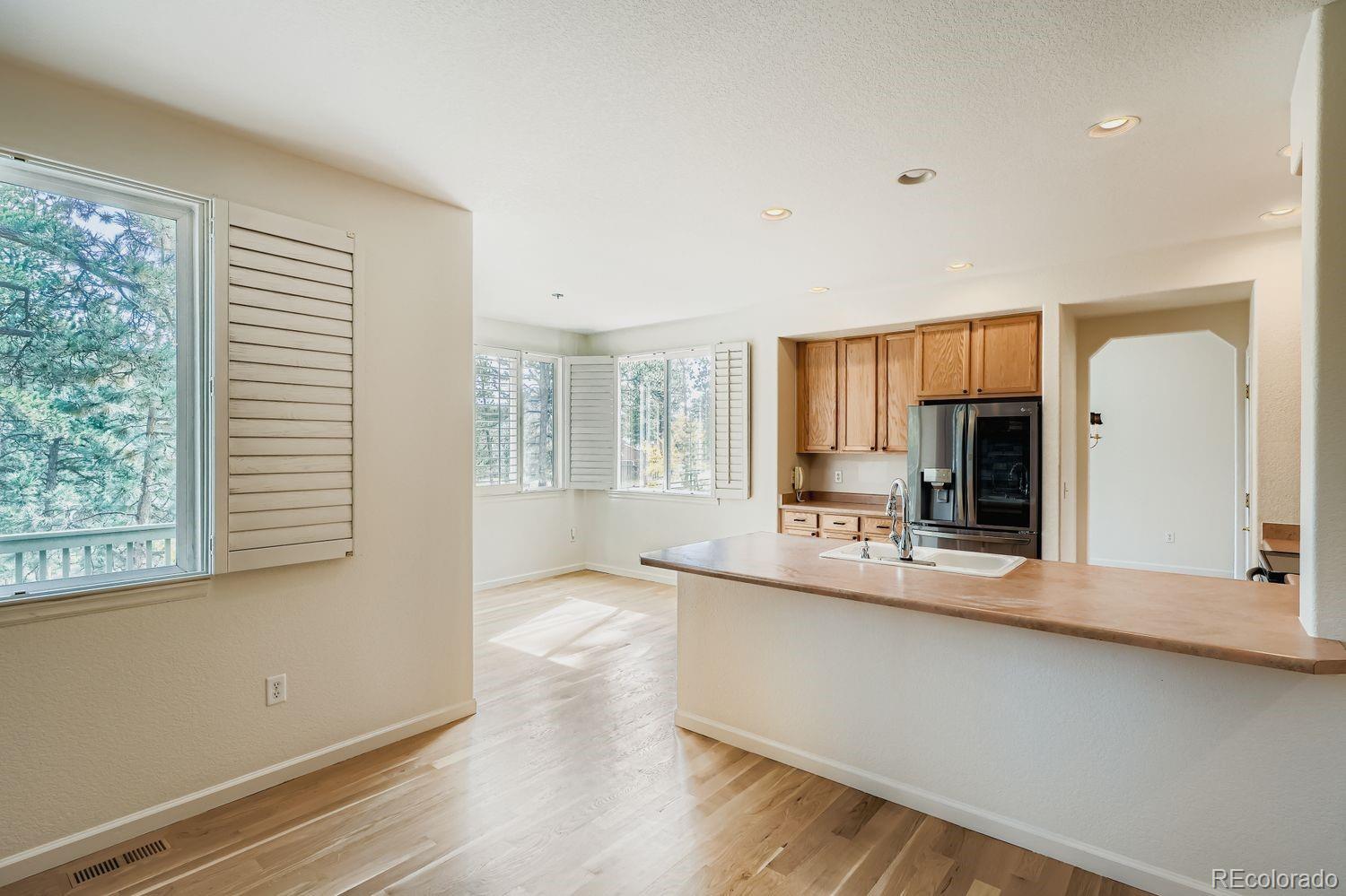 13637 Wamblee Trail Conifer, CO 80433 - Photo 6 of 30 a view of a kitchen with a sink and a large window