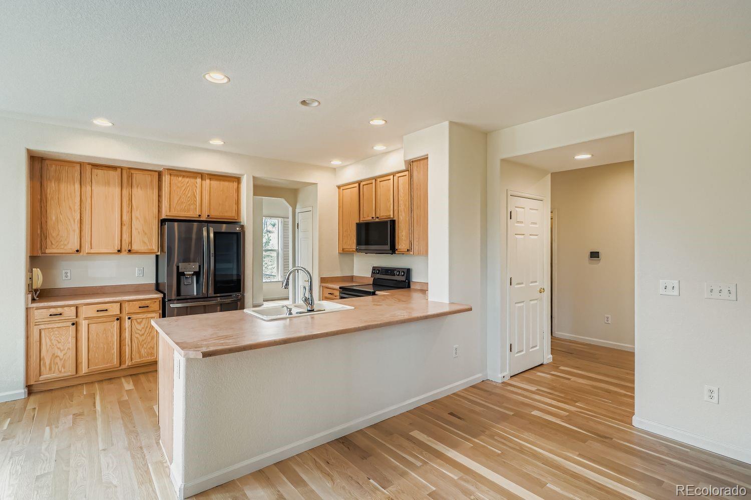 13637 Wamblee Trail Conifer, CO 80433 - Photo 7 of 30 a kitchen with stainless steel appliances granite countertop a refrigerator and a stove top oven